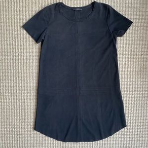 Black tee dress, suede feeling material but still lightweight. Looks amazing on!
